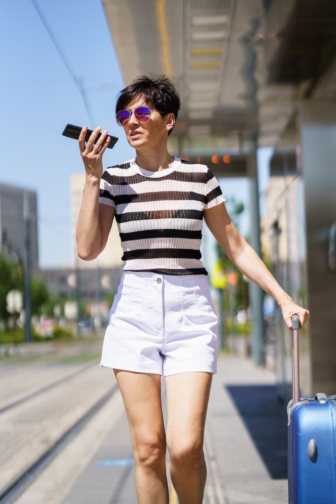 Female speaking on phone while waiting for train