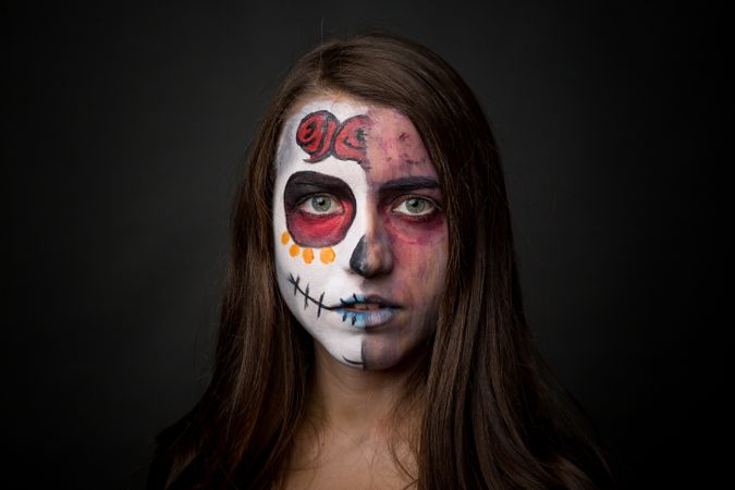 Young woman with creepy face paint
