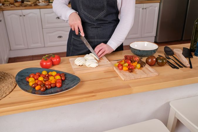 Cook cutting mushrooms and preparing lunch