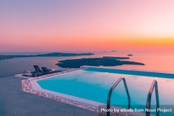 Pool looking out over the Aegean Sea at sunset 4jN3R4
