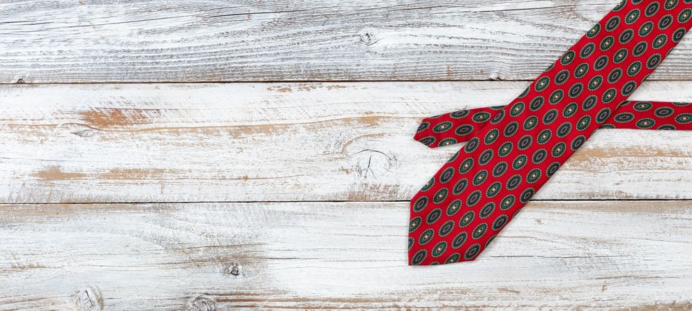 Dotted tie on rustic wood for Father’s Day background