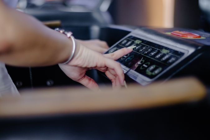 Woman Interacts with Treadmill Interface for Healthy Workout