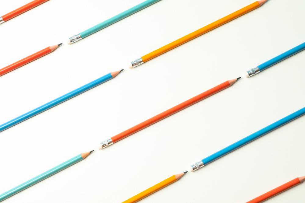 Flat lay composition with pencils on blank background, space for text