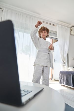 Boy practicing judo at home