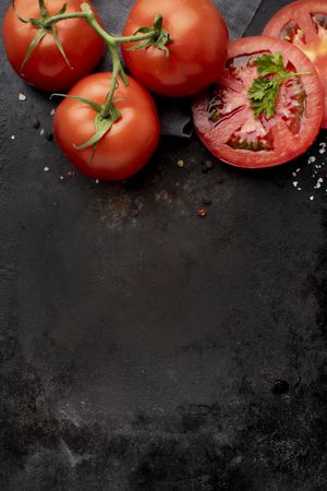 Arrangement of delicious fresh tomatoes with copy space