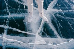 Woman skating on frozen river