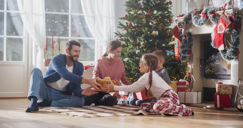 Happy Children Getting New Toys from Mom and Dad