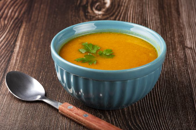 Delicious homemade pumpkin soup in bowl.