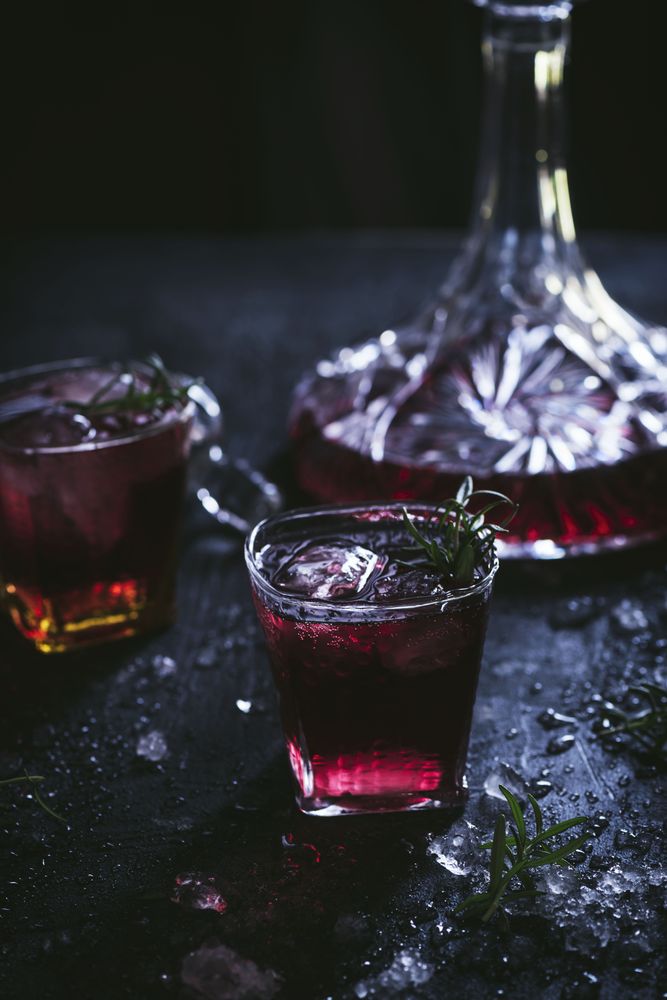 Glasses and carafe with red wine on table