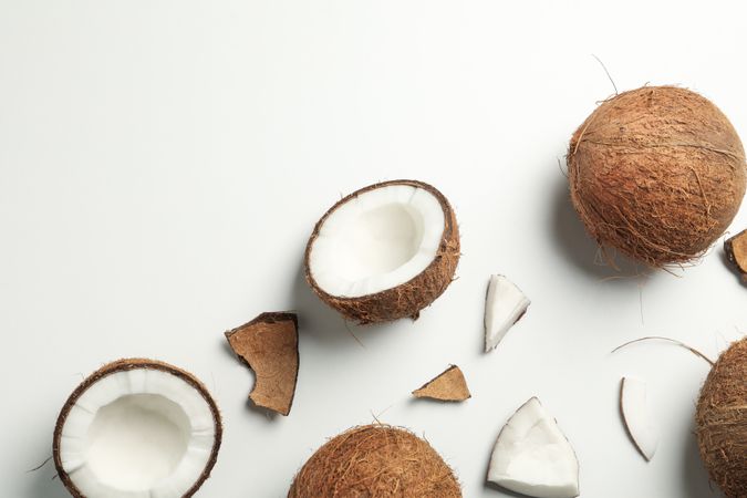 Flat lay with coconut on plain background, top view