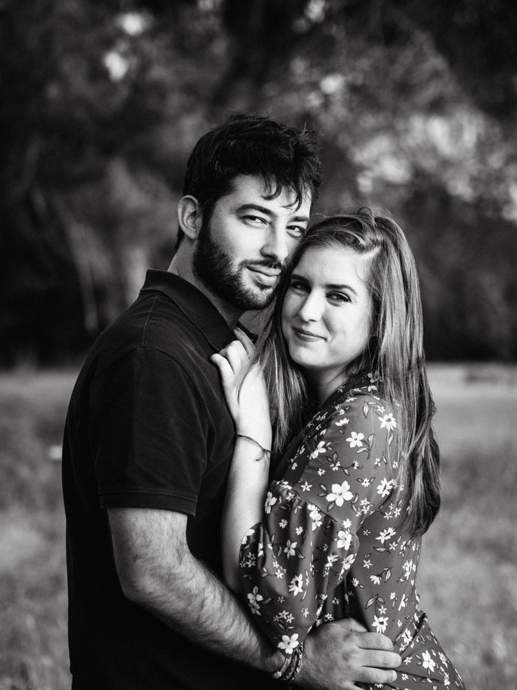 Young happy couple embracing in beautiful garden