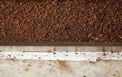Top view of ground nuts on marble counter