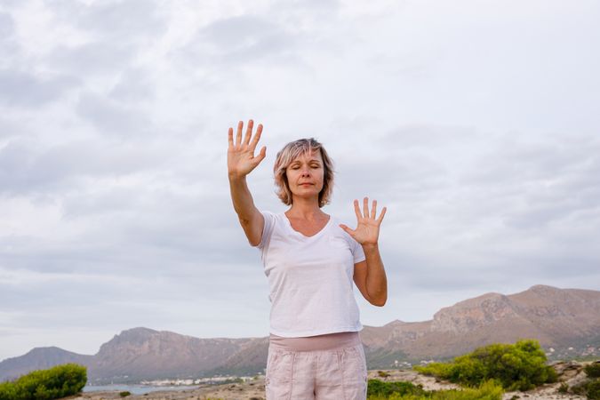 Adult woman doing breathing exercise