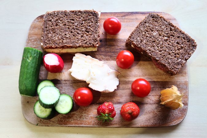 Close view on a healthy german breakfast with sandwiches, tomatoes and cucumbers