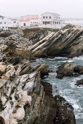 Rocky formations in the island of Baleal on the Atlantic coast in a foggy day. Peniche, Portugal