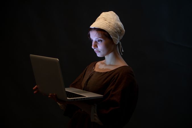 Medieval maid with laptop