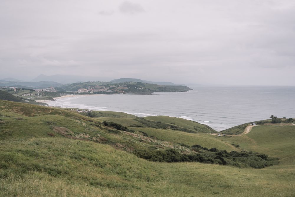 Idyllic countryside on seashore with green fields