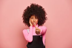 Serious Black woman showing no gesture