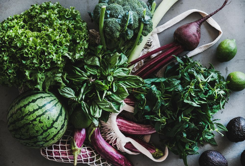 Fresh produce, top view, vertical composition with mesh bag