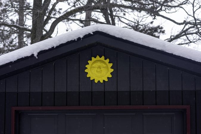Sun detail above garage of home