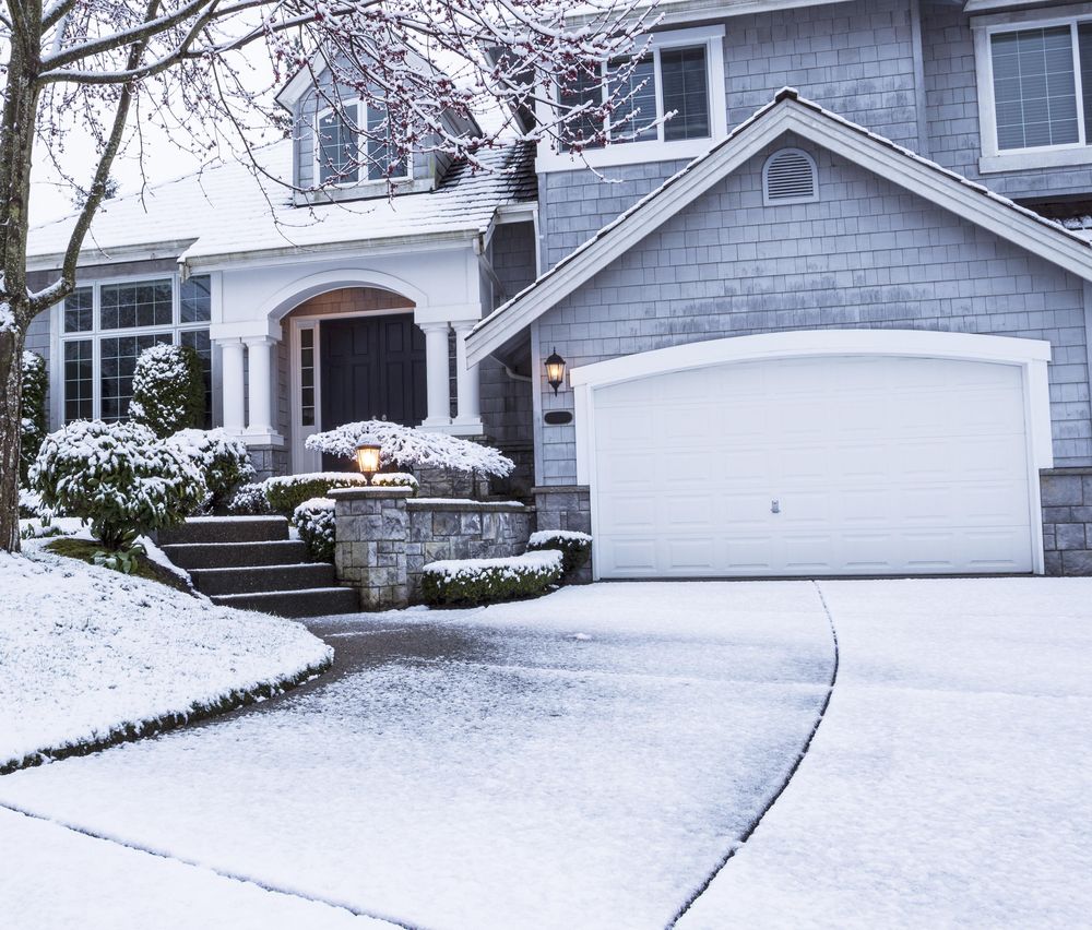 Driveway of suburban house with snow