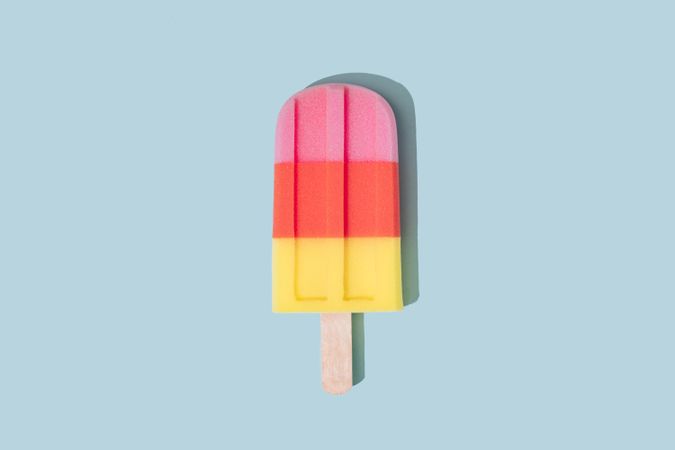 Colorful ice cream popsicle on pastel blue background