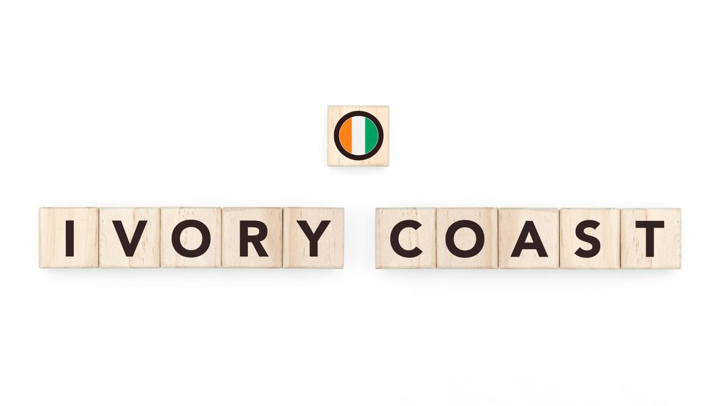 Wooden blocks bearing the name and flag of Ivory Coast. Ivorian and African Culture, national identity, travel, and geography in a copy space design.