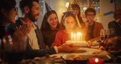 Family Celebrating Birthday with a Young Girl.