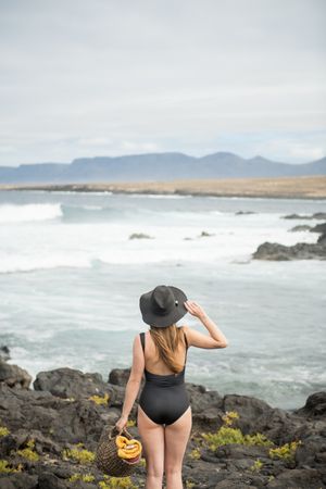 Sensual female near stormy sea
