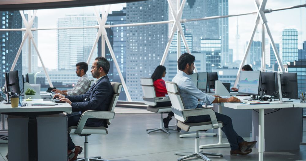 Team of Talented Young Indian Professionals Working in Corporate Hedge Fund.