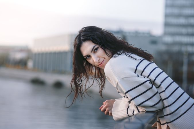 Woman on European street at sunset