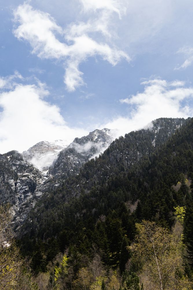Rocky mountains covered with snow on sunny day