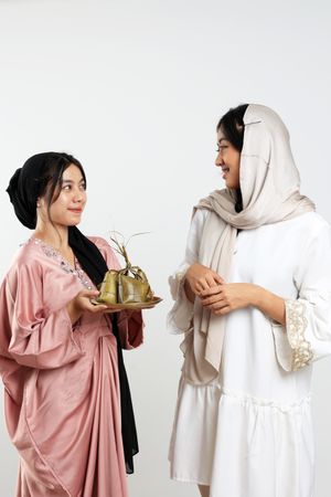 Two Friends Celebration Idul Fitri Or Eid Mubarak with Ketupat