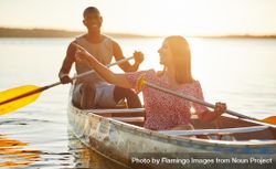 Two people canoeing at sunset bGz2v4