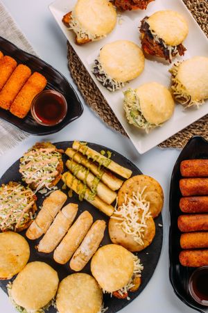 Venezuelan food tasting dish, the dish has arepas, tequeños, yuca and patacones