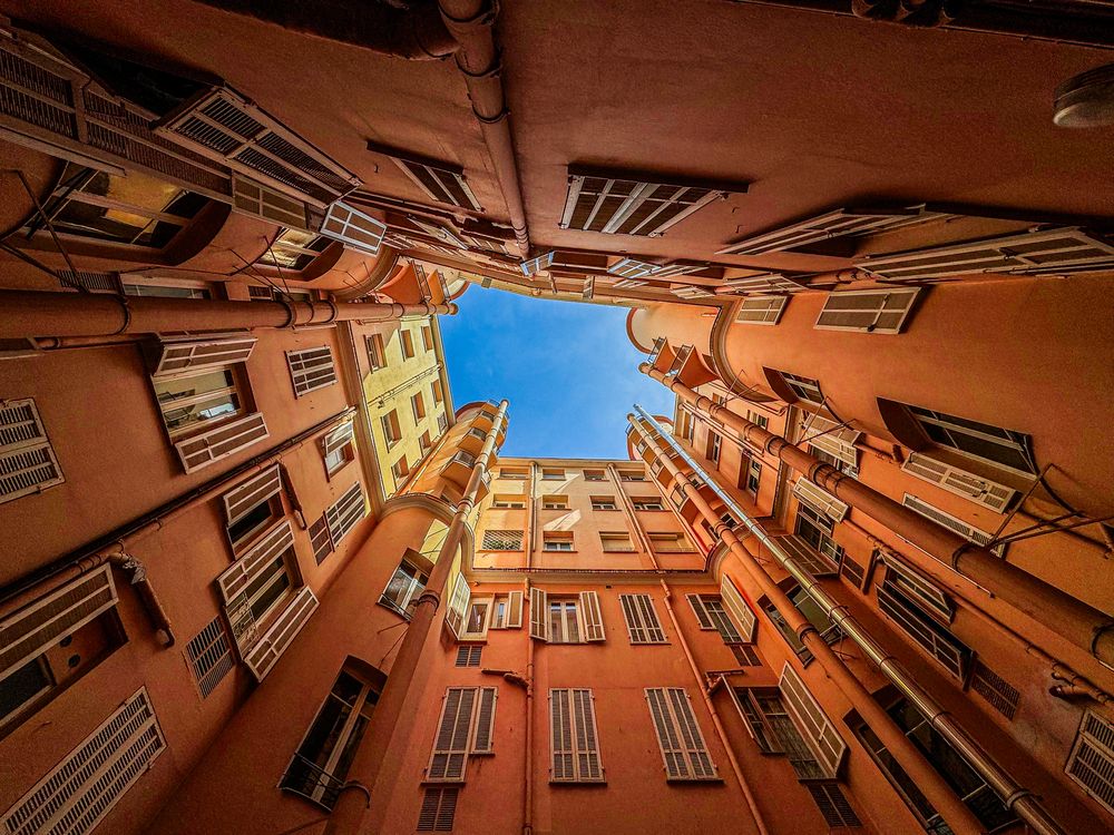 courtyard POV of towering apartment buildings