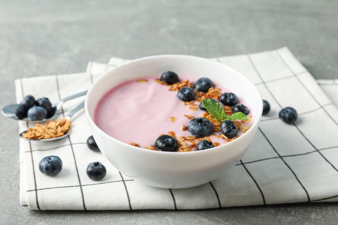 Composition with tasty yogurt on grey background, space for text