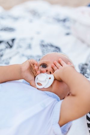 Blonde baby with sleepy expression