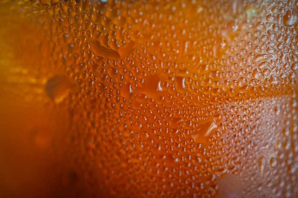 Close up water drop side of glass