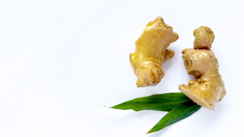 fresh ginger isolated on light background