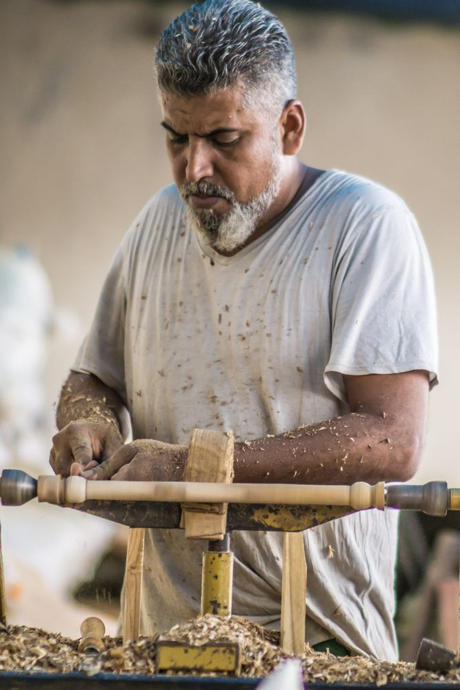 Man using woodworking machine at workplace
