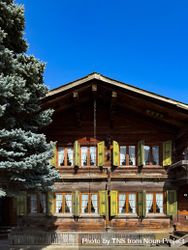 Swiss chalet outside Gstaad, BE on sunny day 0gX7eW