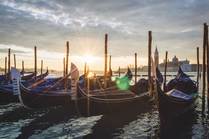 Wooden boats on seashore during sunset