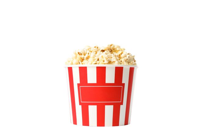 Striped bucket with popcorn isolated on blank background