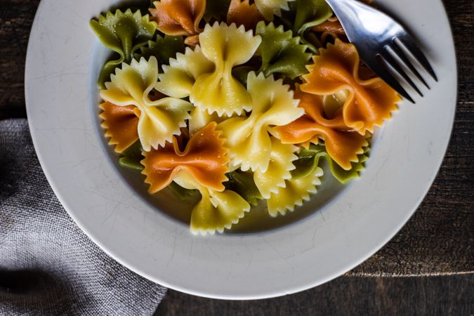Top view of boiled farfalle pasta in a bowl