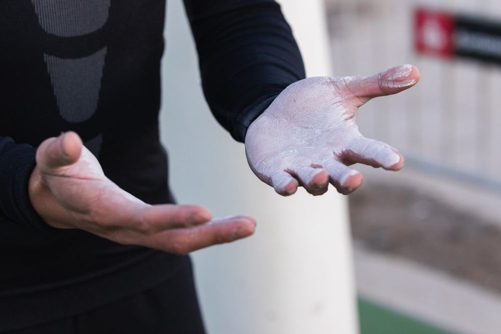 Athletic man with powdered hands