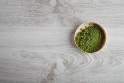 Matcha tea powder in round box