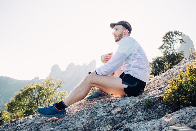 Male athlete stretching after training