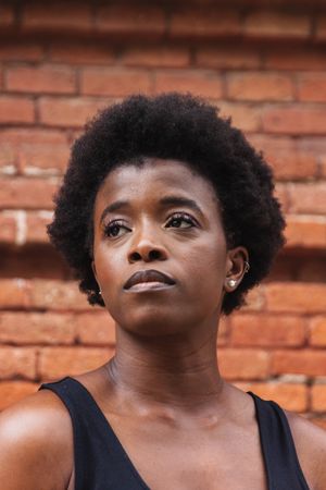 Sad Black woman with Afro hairstyle looking away