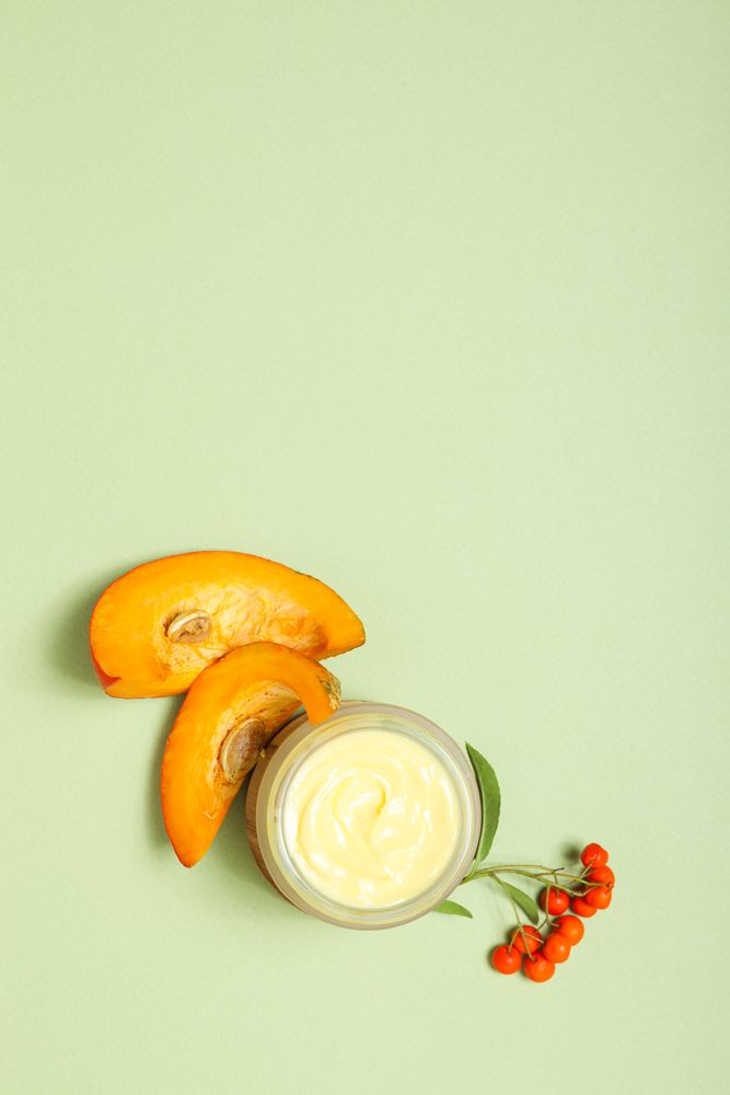 Skin care and face care concept - pumpkin cosmetic